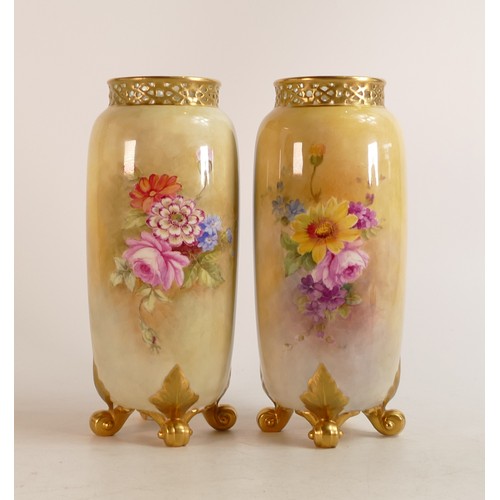 440 - A pair of Royal Worcester footed vases by E Barker, decorated with Bouquet of flowers. Puce marks, h... 