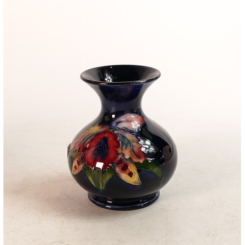 507 - Moorcroft Orchid pattern small vase of flared form. Height: 9cm