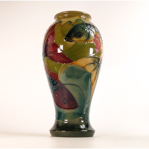 512 - Moorcroft Koi Carp on green ground vase, height 31.5cm.