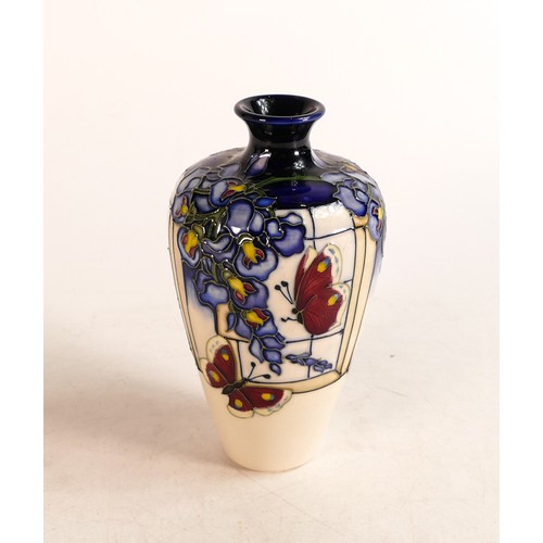 517 - Moorcroft vase in the Wisteria Flutter design. Red dot seconds. Height: 16cm