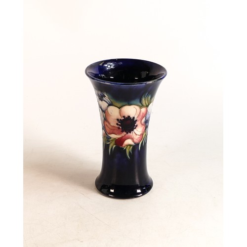 594 - Moorcroft Anemone flared vase on blue background. Height 15cm