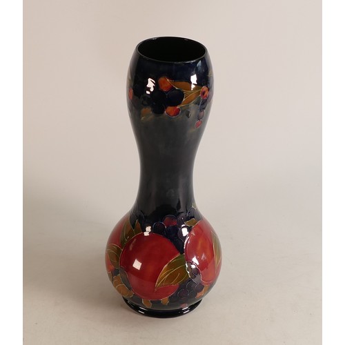 654 - Moorcroft Pomegranate pattern vase, signed W Moorcroft, height 30cm.