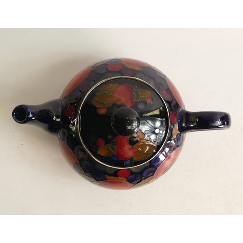 660 - William Moorcroft Pomegranate tea pot, signed. Sterling silver collar replacement. Height 12.5cm