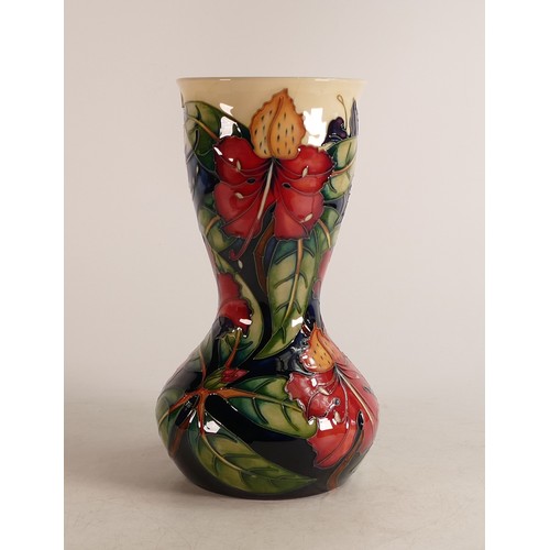 677 - Moorcroft Simeon vase, designed by Philip Gibson. Height 25cm, silver lined seconds