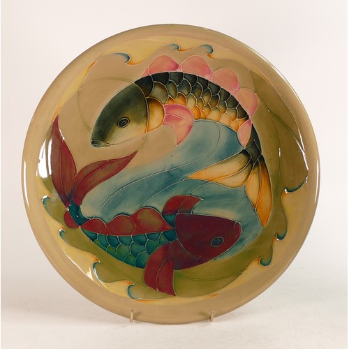 686 - Large Moorcroft charger in the Carp pattern, designed by Sally Tuffin. Diameter 35cm.