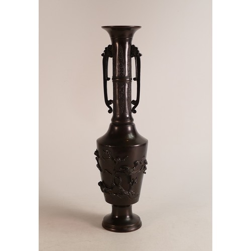 1664 - An early 20th century Bronze style Japanese twin handled vase. Moulded with naturalistic birds and c... 