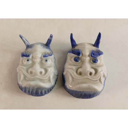 1667 - A pair of Japanese Taisho period mask/ salt Cellars. Modelled as horned Oni with grimacing expressio... 