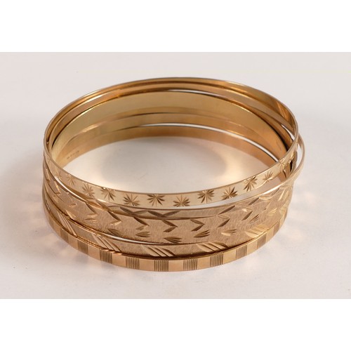 2100 - Seven 9ct gold ornate bangles, 40.3g.