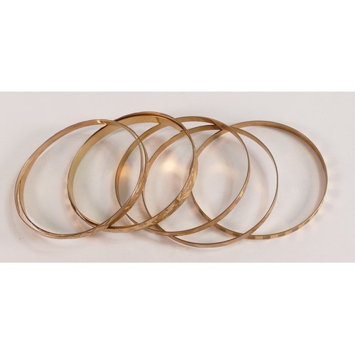 2100 - Seven 9ct gold ornate bangles, 40.3g.