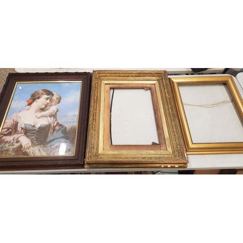 577 - Early 20th century framed print depicting a lady and child, together with two empty frames one being... 