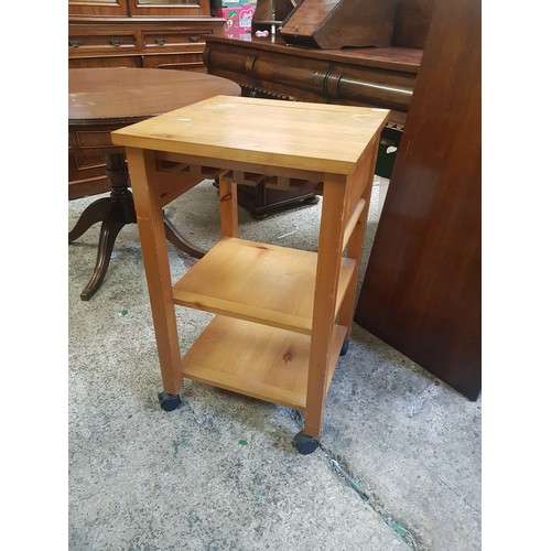 601 - A Modern Butcher Block Style Kitchen Island on Four Plastic Castors and Underneath Storage Shelves. ... 