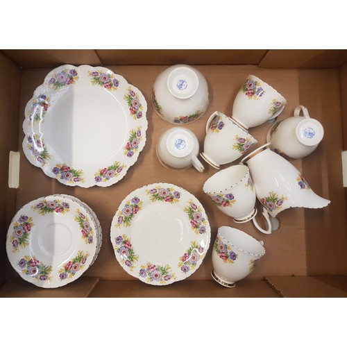 507 - Floral 21 piece tea set, the backstamp reads 'Adult Training Centre - Stoke on Trent'.