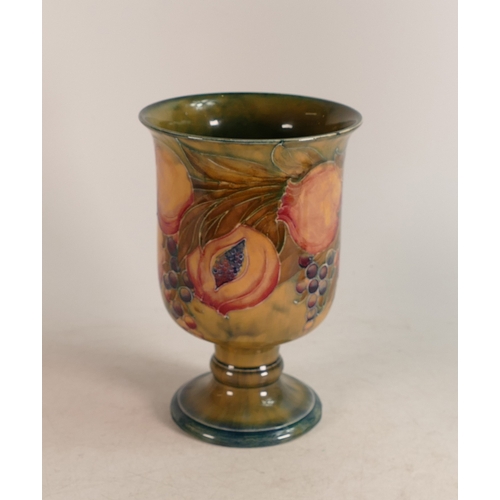 695 - William Moorcroft chalice, c1911, decorated in the pomegranate design on Ochre ground. h.20.5cm. Chi... 