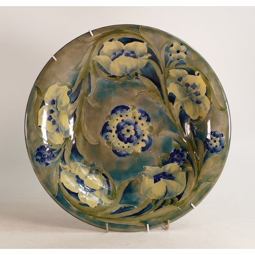 697 - William Moorcroft Burslem late Florian shallow dish/wall plaque, c1916, d.31.5cm.