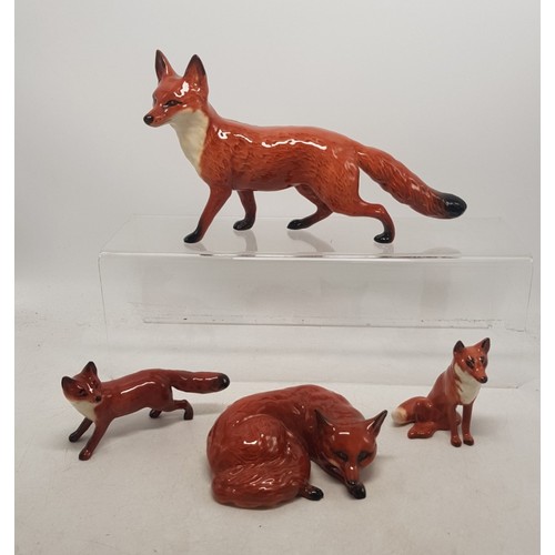 475 - Beswick fox figures to include large standing fox, curled fox, small standing fox and small seated f... 