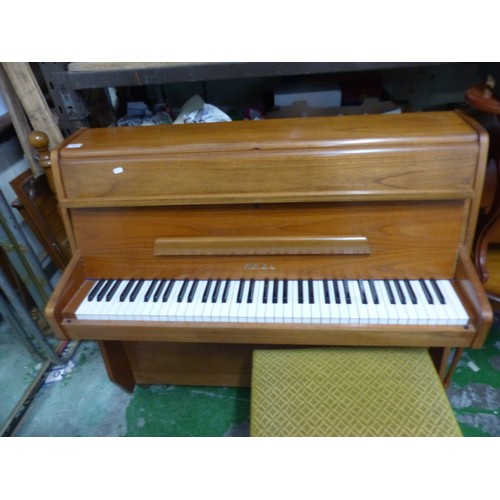 600 - A Bell Upright Piano. Some minor chips to corners and edges noted. Height: 100cm Width: 114cm