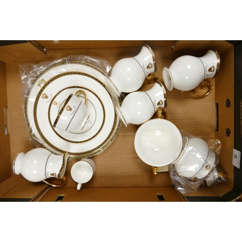 12 - A collection of  De Lamerie Fine Bone China heavily gilded Special Commission items  with with Gudai... 