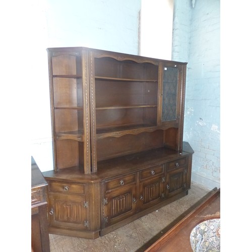 603 - A Large Old Charm Shelving Unit with Linenfold Panels. Five Cupboard and Drawers to Lower Section wi... 