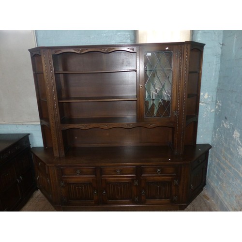 603 - A Large Old Charm Shelving Unit with Linenfold Panels. Five Cupboard and Drawers to Lower Section wi... 