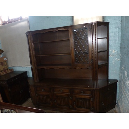 603 - A Large Old Charm Shelving Unit with Linenfold Panels. Five Cupboard and Drawers to Lower Section wi... 