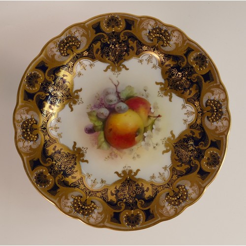 484 - Royal Worcester hand painted comport. Decorated with fruit still life by G H Cole. Cobalt blue groun... 