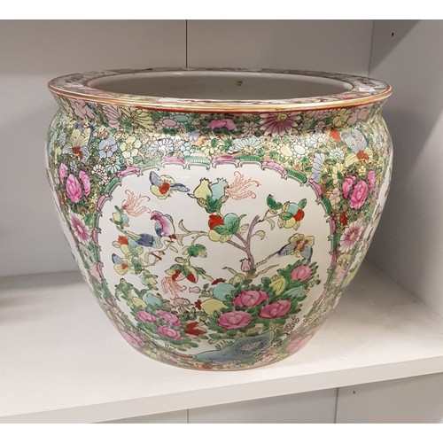 559 - A 20th century Chinese famille vert fishbowl/jardinière, the exterior painted with floral designs, t... 