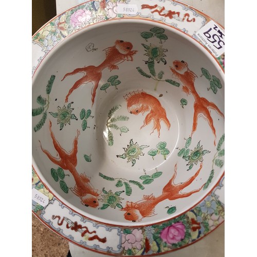 559 - A 20th century Chinese famille vert fishbowl/jardinière, the exterior painted with floral designs, t... 