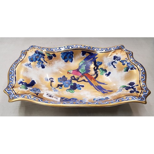 585 - A Keeling's Lo Sol Parrot design blue flow footed fruit bowl in shaped rectangular form.