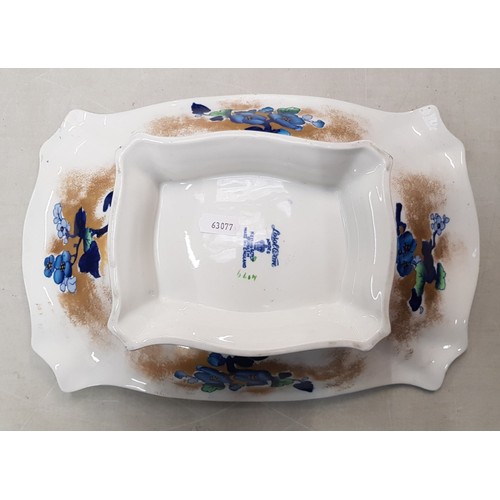 585 - A Keeling's Lo Sol Parrot design blue flow footed fruit bowl in shaped rectangular form.