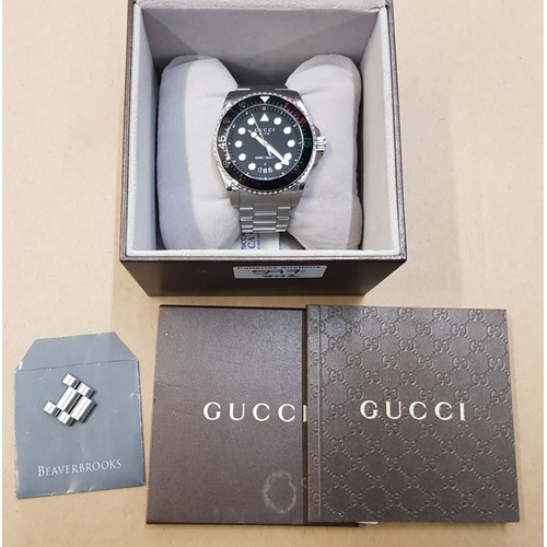 597 - Gucci 'Dive' Gentleman's quartz watch, 200m, date, with box, booklet, spare links, watch is running ... 