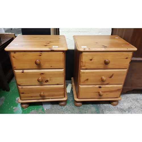 613 - A pair of modern pine effect Bedside cabinets