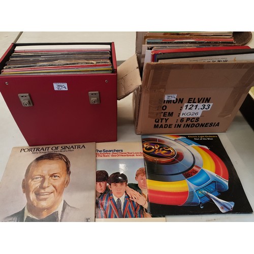 390 - A collection of vinyl albums to include ELO, Frank Sinatra, Shirley Bassey etc (2 boxes).