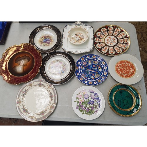 122 - A collection of decorative wall plates including Mason's, Royal Doulton together with a Wedgwood cak... 