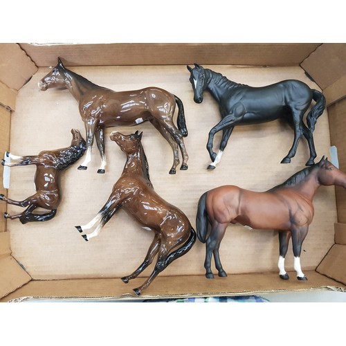 282 - A collection of Beswick horses to include Black Beauty, Heads Up Pony, Arab, 701 horse and a matt Qu... 