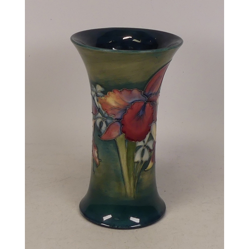 77 - Moorcroft Orchid flared vase on green . Height 15cm