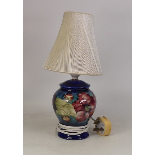 78 - Moorcroft Clematis lamp base on blue. Height to top of fitting 24cm