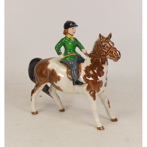 245 - Beswick Girl on Skewbald Pony, model 1499 (rider clothes has been over painted)