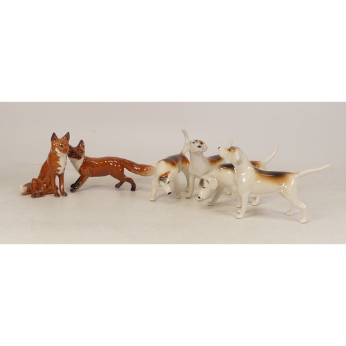 262 - Beswick foxhounds to include 2262, 2263, 2264, 2265 together with small standing fox and small seate... 