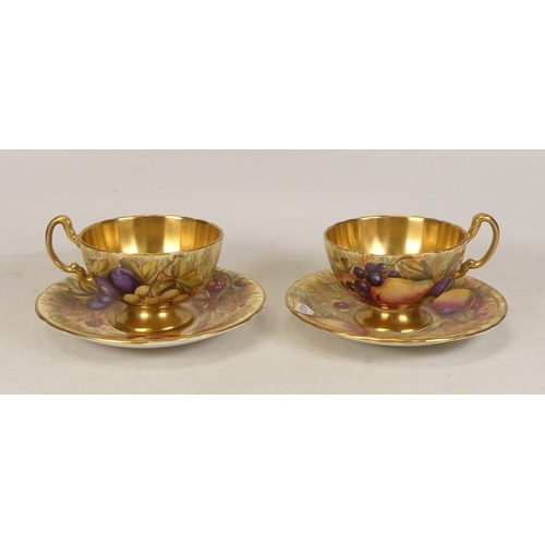 282 - Two Aynsley Orchard Gold Teacups and Saucers. Designs by D. Jones. (2)