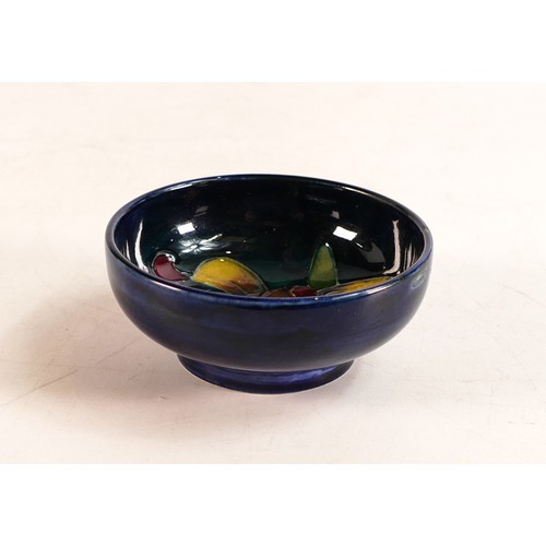 30 - Moorcroft small bowl in the Orchid pattern on blue ground. Impressed Moorcroft Made In England to ba... 