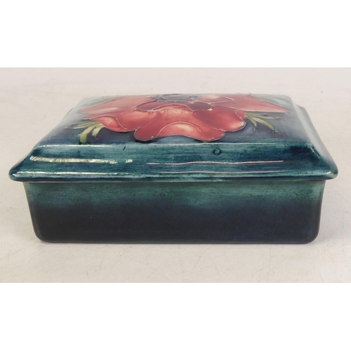 269 - Moorcroft Anemone lidded  box on blue ground. L. 13cm