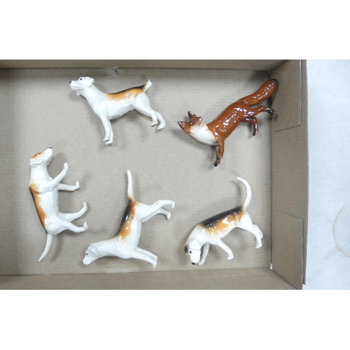 287 - Beswick small standing fox together with 4 fox hounds (5)