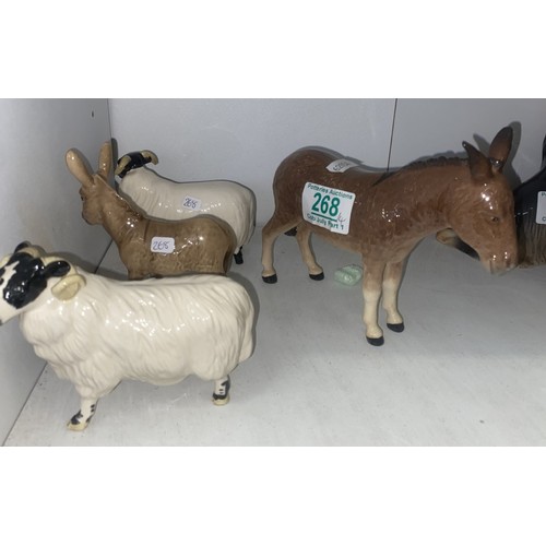 268 - Beswick Donkey 2267A, Donkey foal 2110, black faced sheep 1765 and black faced ram 3071 (4)