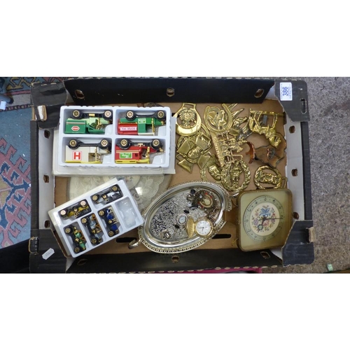 386 - A mixed collection of items to include horse brasses, modern pocket watch, silver plated small tray,... 