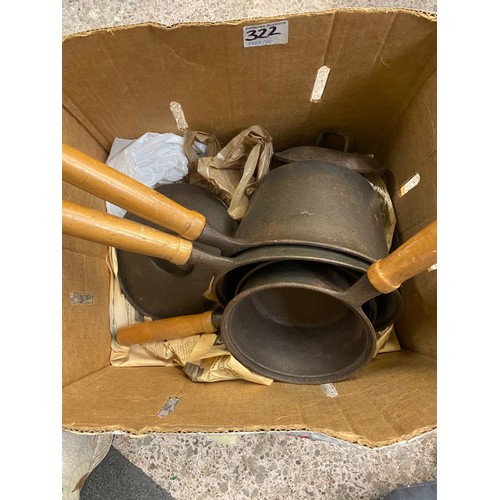 322 - A collection of brass and iron jam pans and saucepans etc.