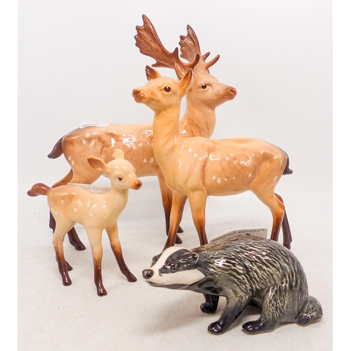 498 - Beswick Stag Family including Stag, Deer and Fawn together with a Beswick Badger (4)