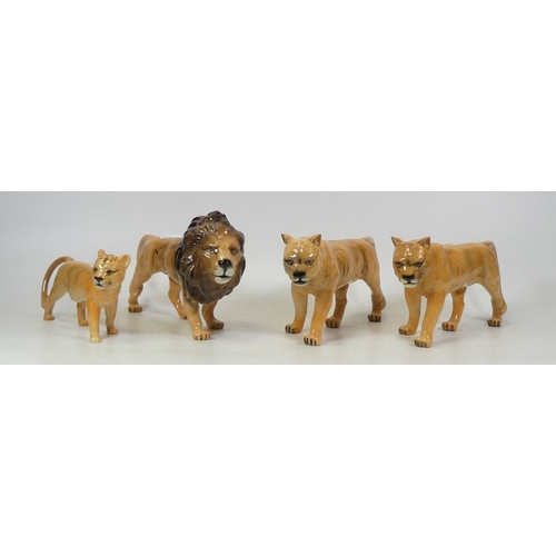 182 - Four Beswick Lion Family Figures to include Lion facing right, Lioness facing left x2 and Cub facing... 