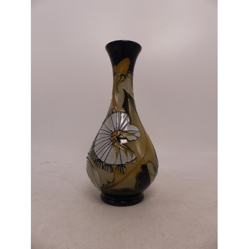 404 - Moorcroft Snail and Flower Design Bottle Vase. Height: 16cm