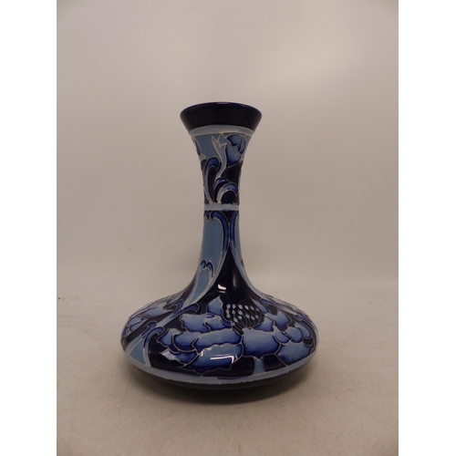 409 - Moorcroft Flori Design bottle vase. Numbered 1 of 50. Height: 15.5 cm high