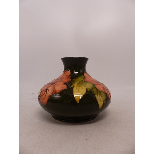 414 - Moorcroft Hibiscus Pattern on Green Ground Squat Vase. Height: 10cm